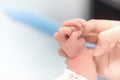 Newborn hand holding mother finger in hospital, Baby and Health care concept, Selective focus and White vignette Royalty Free Stock Photo