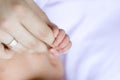 Newborn hand holding mother's finger Royalty Free Stock Photo