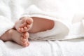 Newborn Ideas. Macro Closeup Shoot of a Four Week Old Baby Boy Feet Over Heap of White Towes Royalty Free Stock Photo