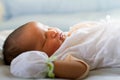 Newborn infant baby girl sleeping in bed Royalty Free Stock Photo