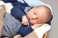 Newborn infant baby sleeping in a basket Royalty Free Stock Photo