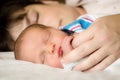 Newborn infant child resting next to mother after delivery