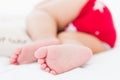 Newborn little baby sleeping on white bed at home