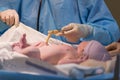 Newborn male baby ready for umbilical cord to be cut Royalty Free Stock Photo