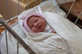 Newborn in maternity hospital,1 day of newborn baby`s birth in a maternity hospital Royalty Free Stock Photo