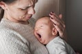 Newborn with mom. 1 month baby with atopic dermatitis Royalty Free Stock Photo