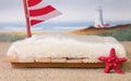 A newborn photography prop of a raft at the ocean.