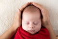 Newborn Sleep on Mum Hands, New Born Girl Smiling and Sleeping, Happy Two Weeks Old Child red Soft warm on White. mother Royalty Free Stock Photo