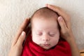 Newborn Sleep on Mum Hands, New Born Girl Smiling and Sleeping, Happy Two Weeks Old Child red Soft warm on White. mother Royalty Free Stock Photo