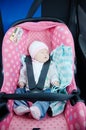 Newborn sleeping in car seat.Safety concept. Infant baby girl. secure driving with children. Baby care lifestyle. Cute baby Royalty Free Stock Photo