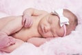Newborn sleeping naked on her side. Royalty Free Stock Photo