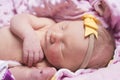 Newborn sleeping naked on her side. Royalty Free Stock Photo