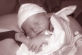 Newborn swaddled and held by mother Royalty Free Stock Photo