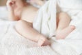 Newborn tiny baby lying on the bed with blanket Royalty Free Stock Photo