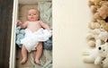 Newborn toddler with peaceful face lies on soft knitted blankets Royalty Free Stock Photo