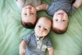 Newborn triplets are lying in the bed Royalty Free Stock Photo