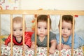 Newborn triplets are lying in the bed Royalty Free Stock Photo