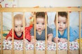 Newborn triplets are lying in the bed Royalty Free Stock Photo