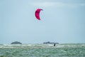 Newborough , Wales - April 26 2018 : Kite flyer surfing at Newborough beach - Wales - UK