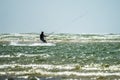 Newborough , Wales - April 26 2018 : Kite flyer surfing at Newborough beach - Wales - UK