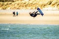 Newborough , Wales - April 26 2018 : Kite flyer surfing at Newborough beach - Wales - UK