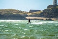 Newborough , Wales - April 26 2018 : Kite flyer surfing at Newborough beach - Wales - UK