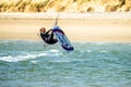 Newborough , Wales - April 26 2018 : Kite flyer surfing at Newborough beach - Wales - UK