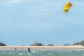 Newborough , Wales - April 26 2018 : Kite flyer surfing at Newborough beach - Wales - UK