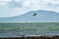 Newborough , Wales - April 26 2018 : Kite flyer surfing at Newborough beach - Wales - UK