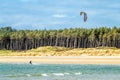 Newborough , Wales - April 26 2018 : Kite flyer surfing at Newborough beach - Wales - UK