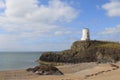 TÃÂµr Mawr lighthouse, on Ynys Llanddwyn on Anglesey, Wales, marks the western entrance to the Menai Strait. Royalty Free Stock Photo