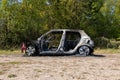 Newburn UK: A stolen car which has been burnt out and dumped in a field Royalty Free Stock Photo