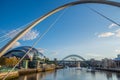 Newcastle Gateshead Quayside with River Tyne, Gateshead Millenium Bridge, Sage Gateshead concet hall and Tyne Bridge in view Royalty Free Stock Photo