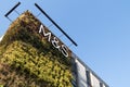 Exterior of Marks and Spencers M & S building with living green wall. Showing company logo, sign, signage and branding