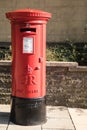 Exterior Red Royal Mail Pillar Post Box on street Royalty Free Stock Photo