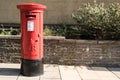 Exterior Red Royal Mail Pillar Post Box on street Royalty Free Stock Photo