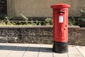 Exterior Red Royal Mail Pillar Post Box on street Royalty Free Stock Photo