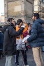 Man being interviewed with a microphone on the street