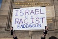 Man holding anti-Israeli placard at the Free Palestine Rally