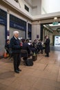 Salvation Army Band playing in public space with members collecting charity donations