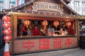 Street food vendor kiosk selling hot cooked chinese noodles food in the street