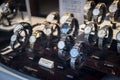 Window display of luxury watches for sale in high street shop
