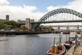 Newcastle Quayside with boats moored and bridges Royalty Free Stock Photo