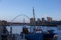 Newcastle Quayside with Gateshead Millenium Bridge and Boat in s