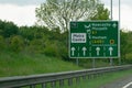 Green sign on the A1 motorway directing transport and drivers to Metro centre or Newcastle or Hexham.