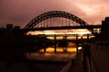 Tyne bridge at sunset in silhouette with reflection on River Royalty Free Stock Photo