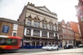 Newcastle Tyne Theatre building exterior with traffic moving past