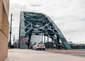 Low angle street view of a rusty Tyne bridge in Newcastle