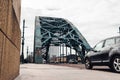 Low angle street view of a rusty Tyne bridge in Newcastle