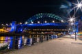 Tyne Bridge illuminated on the Quayside view at night with car light trails